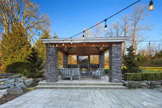 The Breathtaking $400,000 Recent Heated Outdoor Living Space Addition Is An Entertainer’s Dream Featuring A Wood-Burning Fireplace, 2 Heaters & TV.