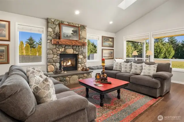 Fabulous great room with custom mantle and rock fireplace.