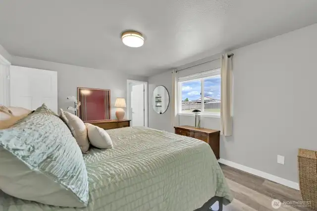 Lots of natural light in the primary bedroom that faces the backyard