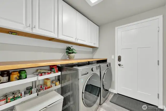 Laundry/ mudroom of off the garage, updated and Washer/dryer stay with the home