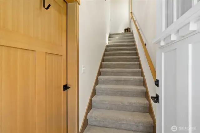 Entry way leading to main living area and garage access.