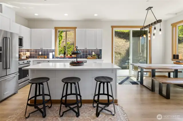 Kitchen with eating space and separate dinning area with back deck access.