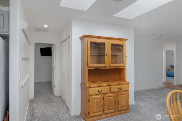 Hallway leads to the primary bedroom and suite