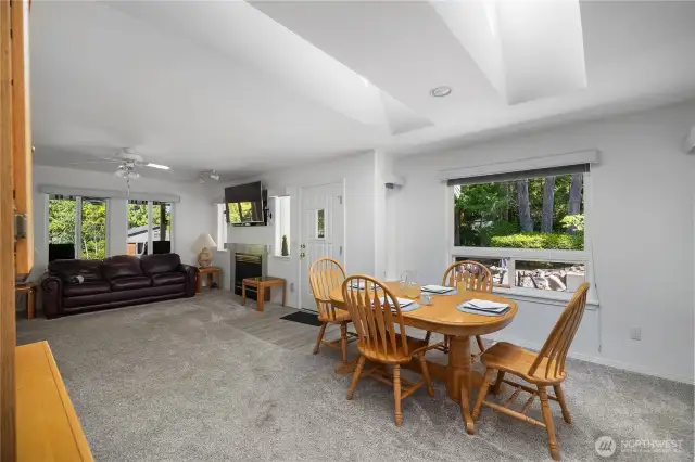 Looking to the dining room, great room, and side entrance.