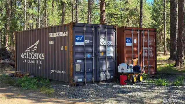 Large shipping containers convey w/sale and provide an abundance of storage.