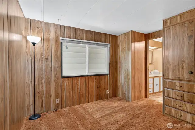 The second bedroom opens to the second bathroom for an en-suite effect.