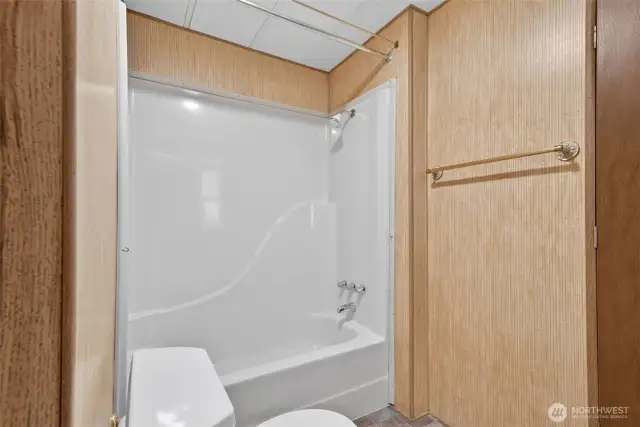 Second bath has a tub and shower combo.