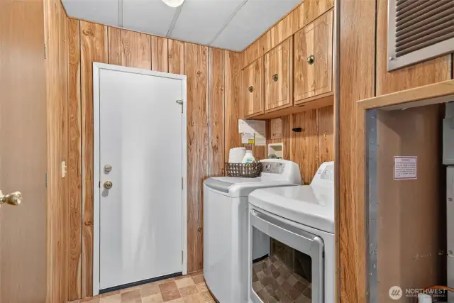 Off the garage entrance is a utility room with washer and dryer that stay with the home.