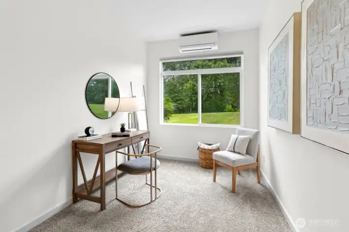 Versatile niche in the primary suite with air conditioning and serene greenbelt views—start your day watching deer graze or simply enjoy the view.