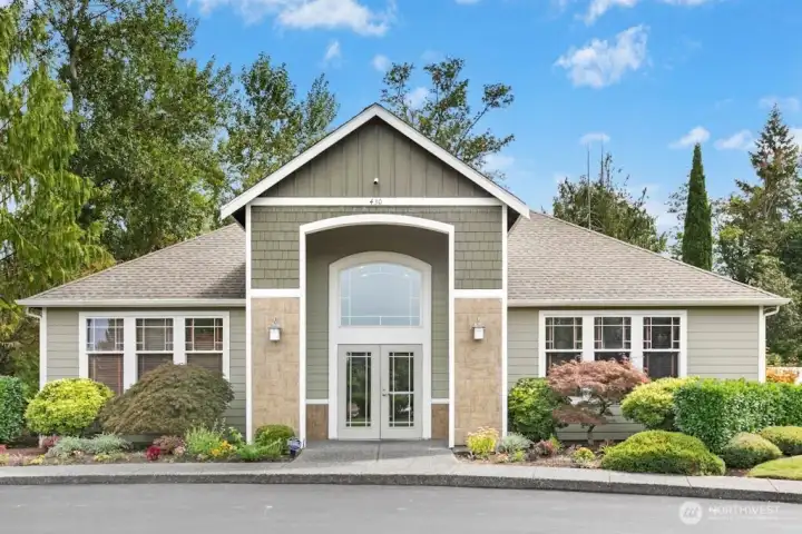 The charming clubhouse, shared by Cameray and Bordeaux residents, features welcoming spaces including a large entry area often used for yoga, cozy living and meeting rooms, a kitchenette, fitness center, restrooms with showers, and a relaxing indoor spa with easy access to the outdoor heated pool.