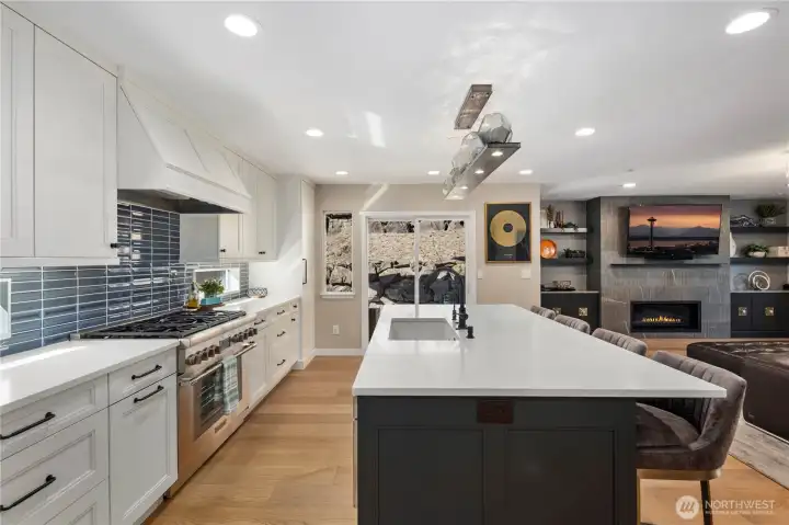 Kitchen with quartz counters, custom soft-close cabitenary, stainless steel appliances and much more.