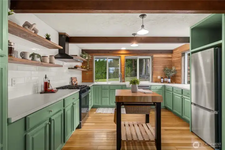 Refreshed kitchen with new appliances and freshly painted cabinets
