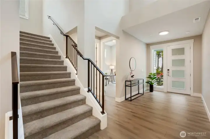 Thoughtfully placed staircase with an airy bright flow