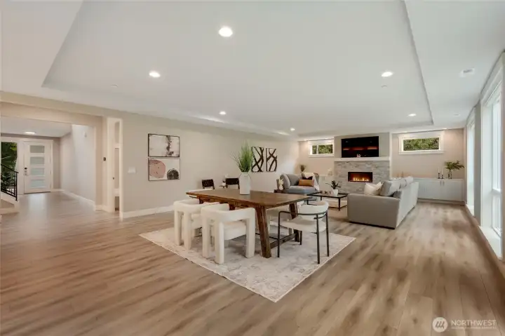 Spacious great room with cozy fireplace and open flow from the kitchen to the outdoors.