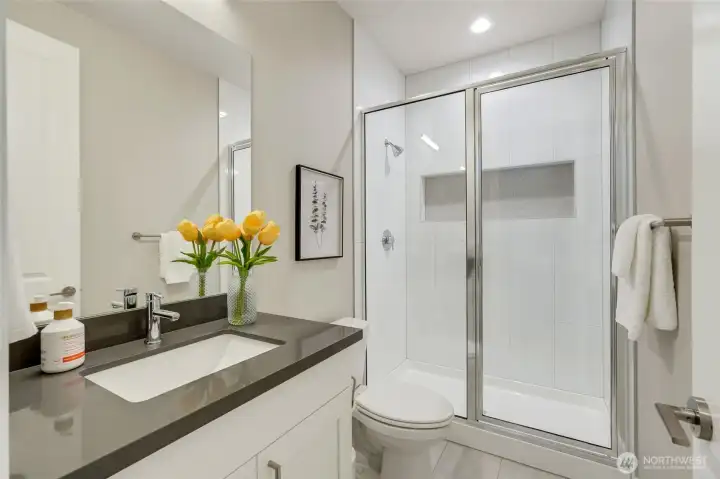 “Main-floor full bath offers convenience for guests, multi-generational living, or a private home office suite.”