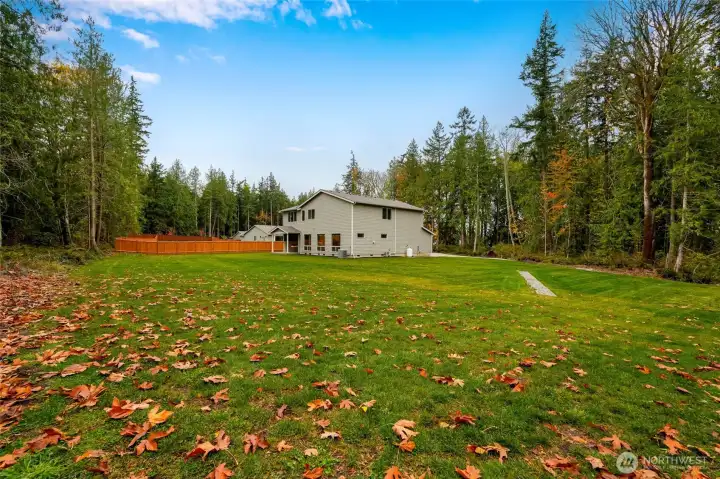 1.3 Acres Set on a private and usable 1.3-acre lot with a beautiful treed backdrop and wide open lawn—ideal for pets, play, gardens, and adding your future shop or RV space.