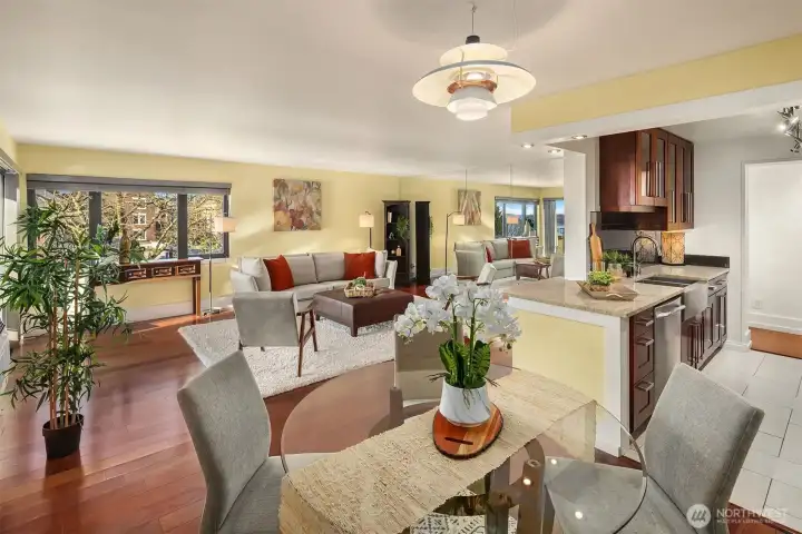 Dining room & kitchen with serving bar that opens to the living room