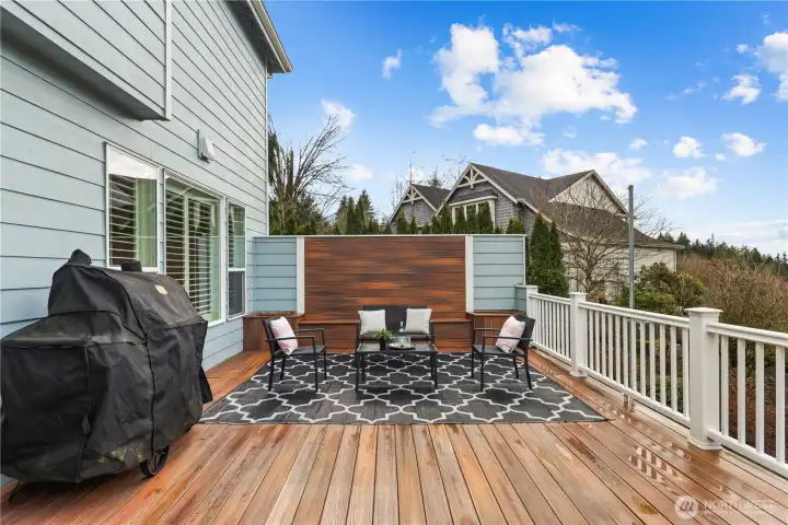 Built in seating bench with planters on this privacy wall