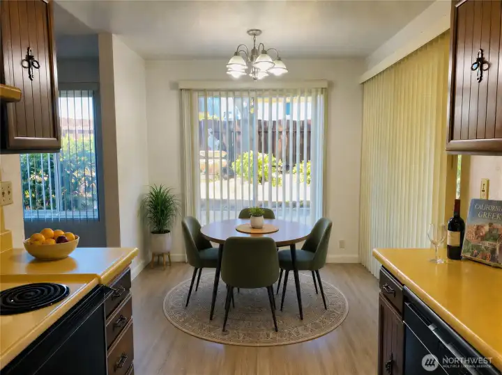 8848 kitchen and dining with LVP flooring and yard access