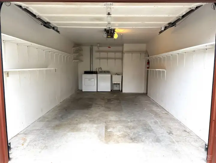 8850 oversized attached garage with full-size laundry, utility sink, and generous storage