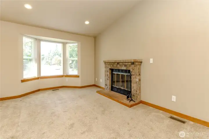 Living Room has vaulted ceilings with canned lights