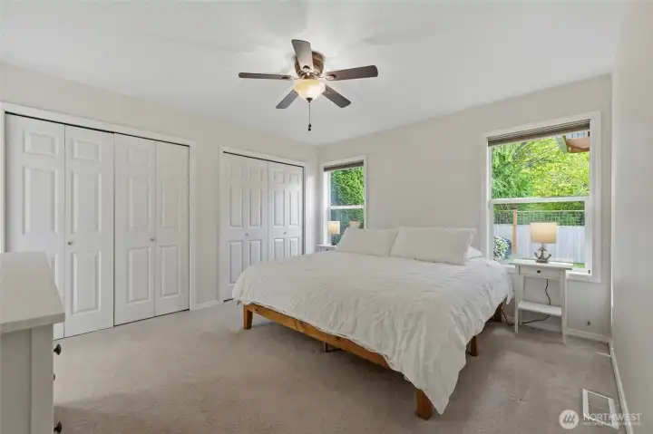 “Relaxing primary retreat with peaceful backyard views.” “Relaxing primary retreat with peaceful backyard views.”