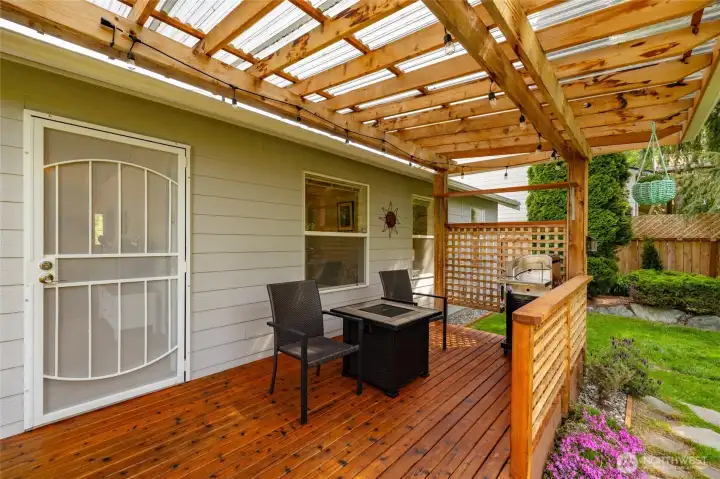 Perfect for BBQs or simply sitting back with a good book, this covered deck offers a relaxing space to enjoy the outdoors in comfort. Perfect for BBQs or simply sitting back with a good book, this covered deck offers a relaxing space to enjoy the outdoors in comfort.