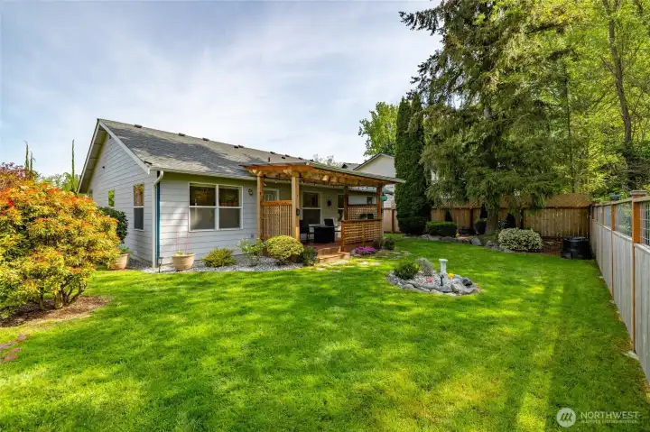 Backyard space designed for both two-legged and four-legged family members alike—room to relax, play, and enjoy the outdoors. Backyard space designed for both two-legged and four-legged family members alike—room to relax, play, and enjoy the outdoors.