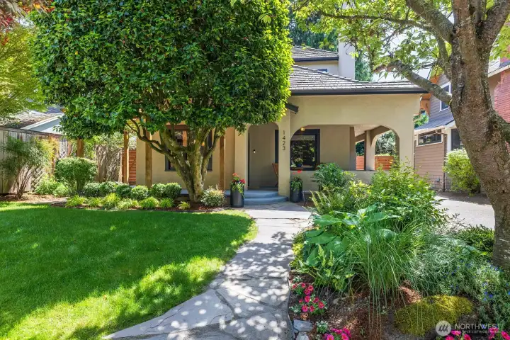 Fresh front landscaping leads the way to this beautiful bungalow.