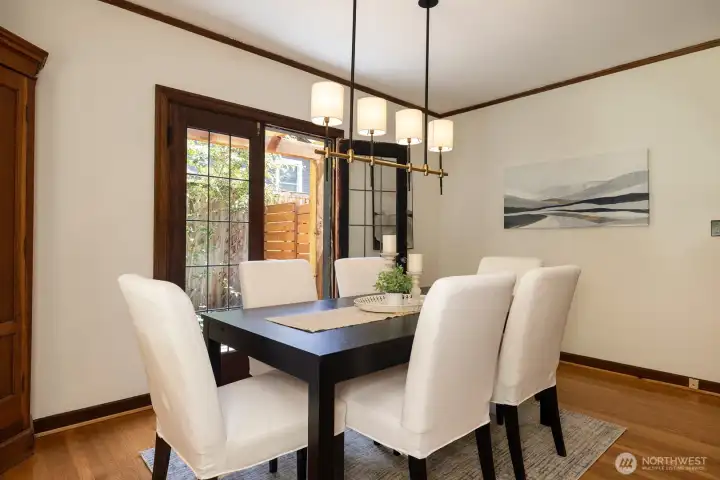 Great dining space with French doors opening to the wrap-around patio.