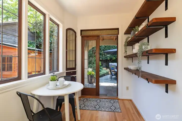 Enjoy morning coffee in the lovely breakfast nook with leaded glass windows & French doors.