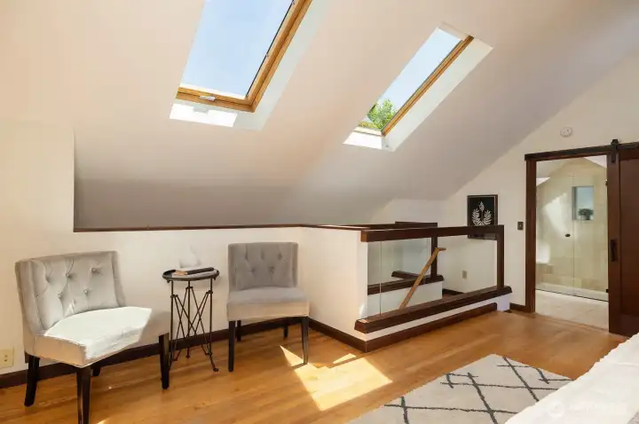 Skylights illuminate the sitting area in the primary suite.