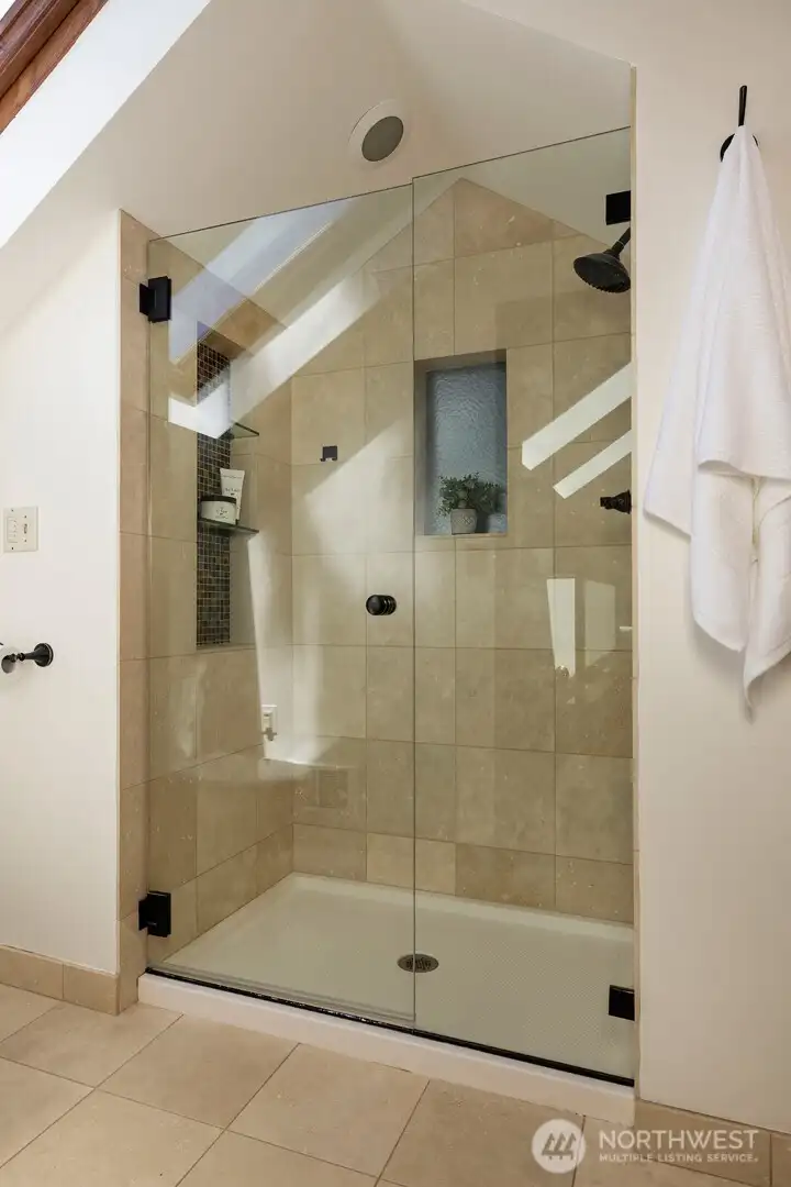 Extra-large walk-in shower in the primary bathroom.