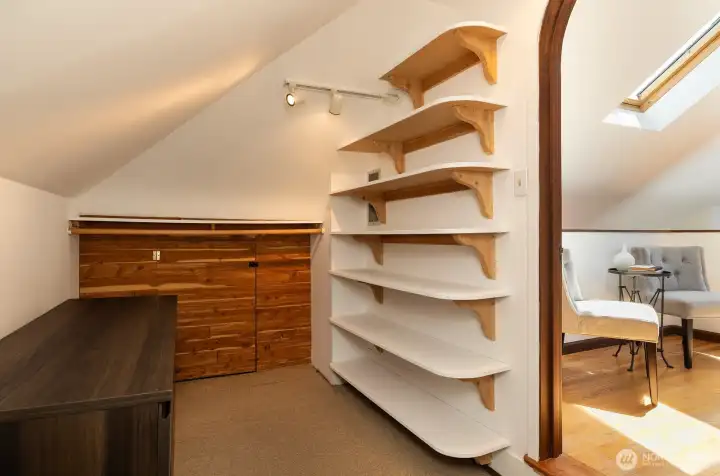 A walk-in closet with custom shelving completes the primary suite.