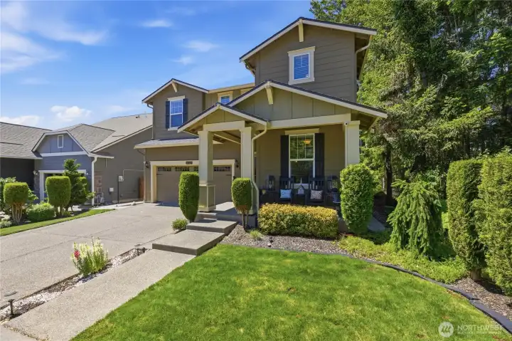Front view of house with greenbelt on the right.