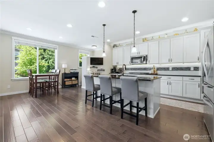 Kitchen has Soft Close Cabinets and Drawers, Island with seating, and Breakfast Nook