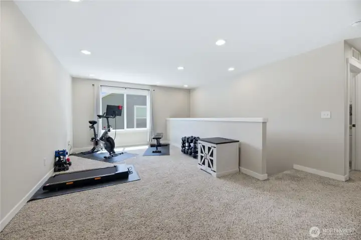 Loft being used as a workout area.