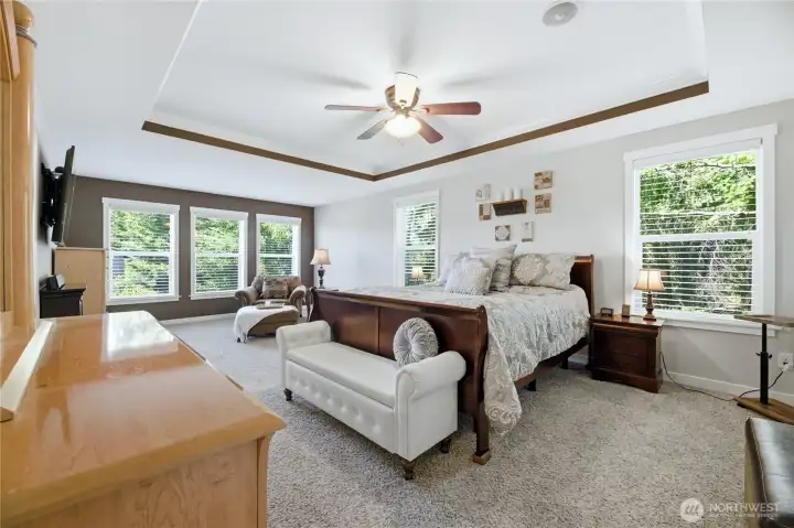 Grand primary suite is a true sanctuary with a peaceful sitting area.