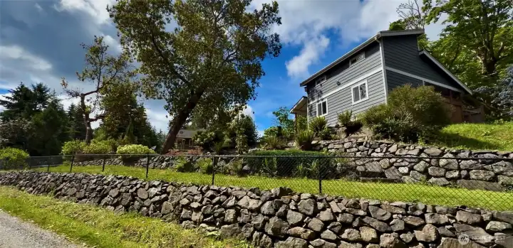 Beautiful fully fenced corner lot - view from lower corner as you approach property