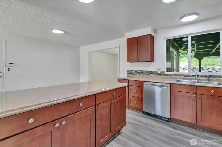 Extra-long Breakfast Bar! Generous kitchen storage areas below and above!