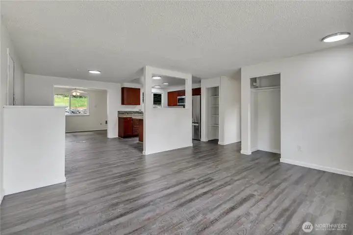 Updated flooring and lighting and numerous windows make everything bright and cheery!