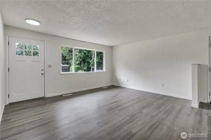 Lovely six-pane windows in entry door!Extra-large picture window!