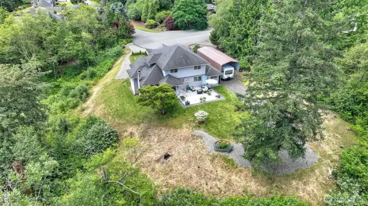 Drone shot of backside of house and yard