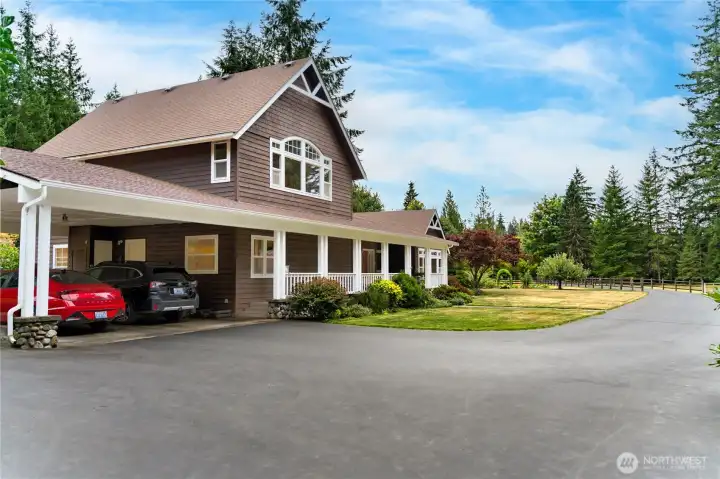 An attached carport offers covered parking for two vehicles. An attached carport offers covered parking for two vehicles.