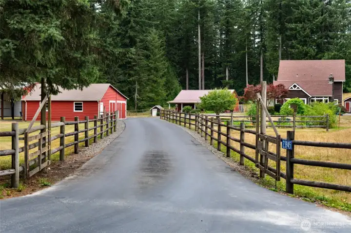 Lovely three rail farm fence leads you down the blacktop driveway off Martin Rd. Lovely three rail farm fence leads you down the blacktop driveway off Martin Rd.