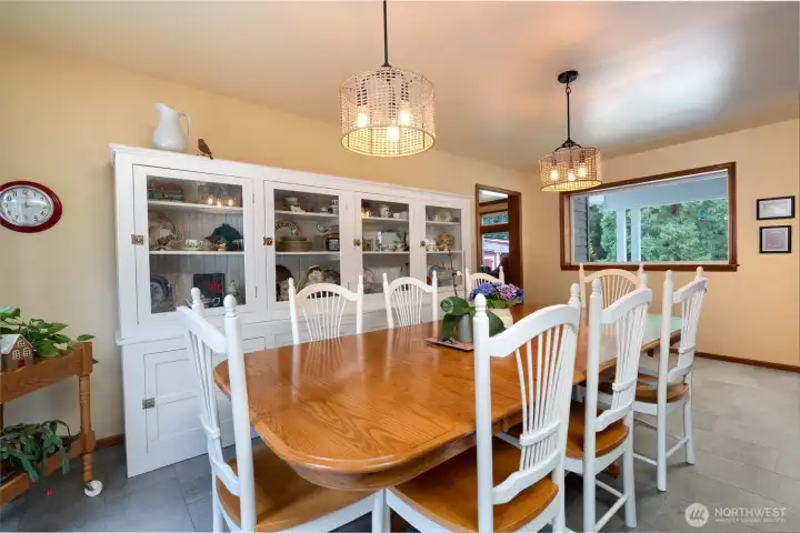 Dining room accommodates a large table and hutch, perfect for entertaining dinner guests. Dining room accommodates a large table and hutch, perfect for entertaining dinner guests.