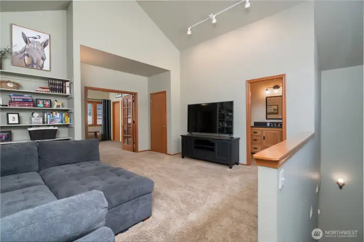 Head upstairs to your expansive Primary bedroom suite! The private living room is perfect for unwinding. Head upstairs to your expansive Primary bedroom suite! The private living room is perfect for unwinding.