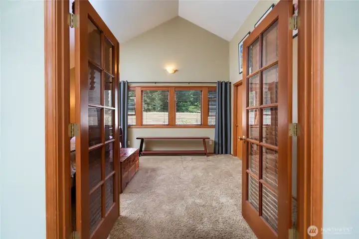Primary bedroom has french doors to close off the adjacent living room. Primary bedroom has french doors to close off the adjacent living room.