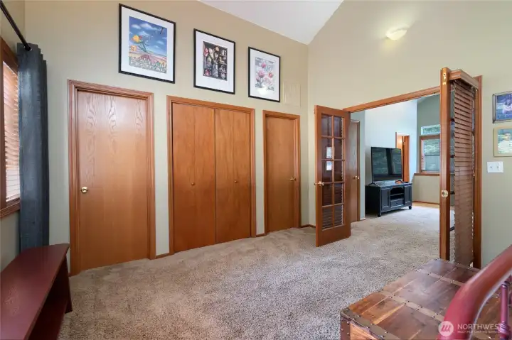 Dual walk-in closets and a center area originally designed for TV/Entertainment Center offers additional storage. Dual walk-in closets and a center area originally designed for TV/Entertainment Center offers additional storage.