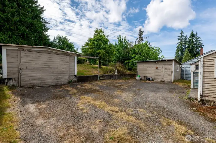 parking area - back side of house- shed to the north garage to the south